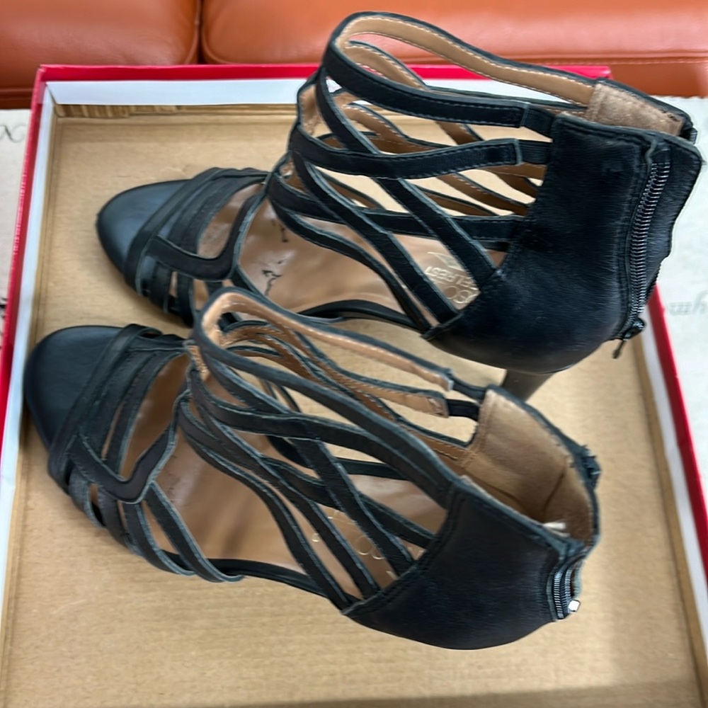 Black heels with beautiful design.